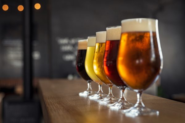 Glasses,With,Different,Sorts,Of,Craft,Beer,On,Wooden,Bar.