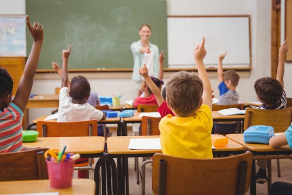 Pupils,Raising,Their,Hands,During,Class,At,The,Elementary,School